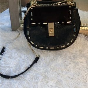 Black crossbody purse with gold detail